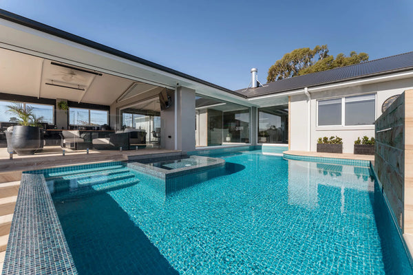 Custom concrete pool integrated with a contemporary Melbourne home